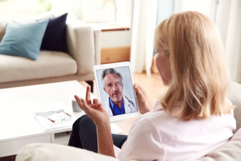 woman telemedicine call with medical professional utc